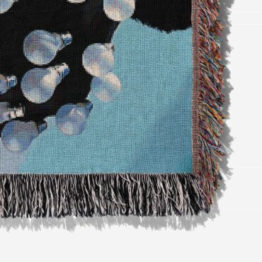 Delicate Sound Of Thunder Lightbulb Man Woven Blanket